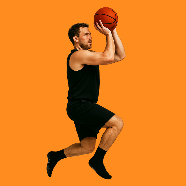 Man shooting basketball in Osterlo basketball socks